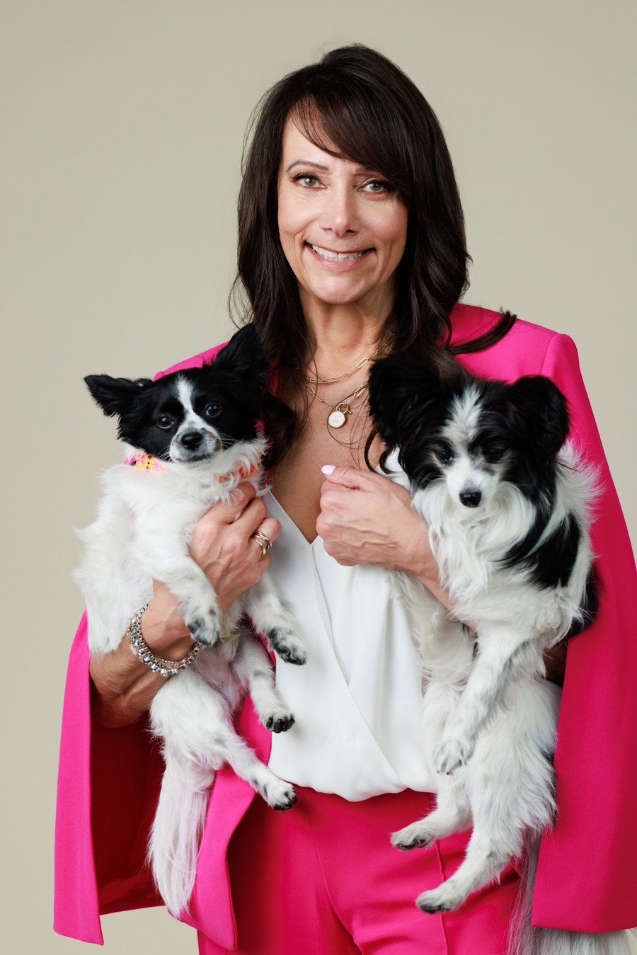 woman holding a two small dogs professional photo pooja photography