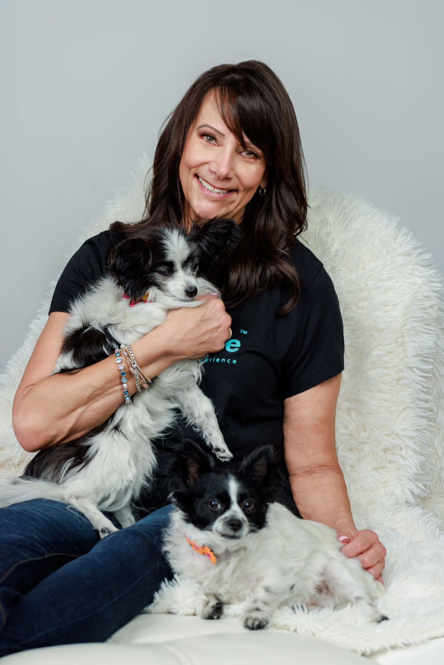 woman holding a small dog professional photo pooja photography puppy love party